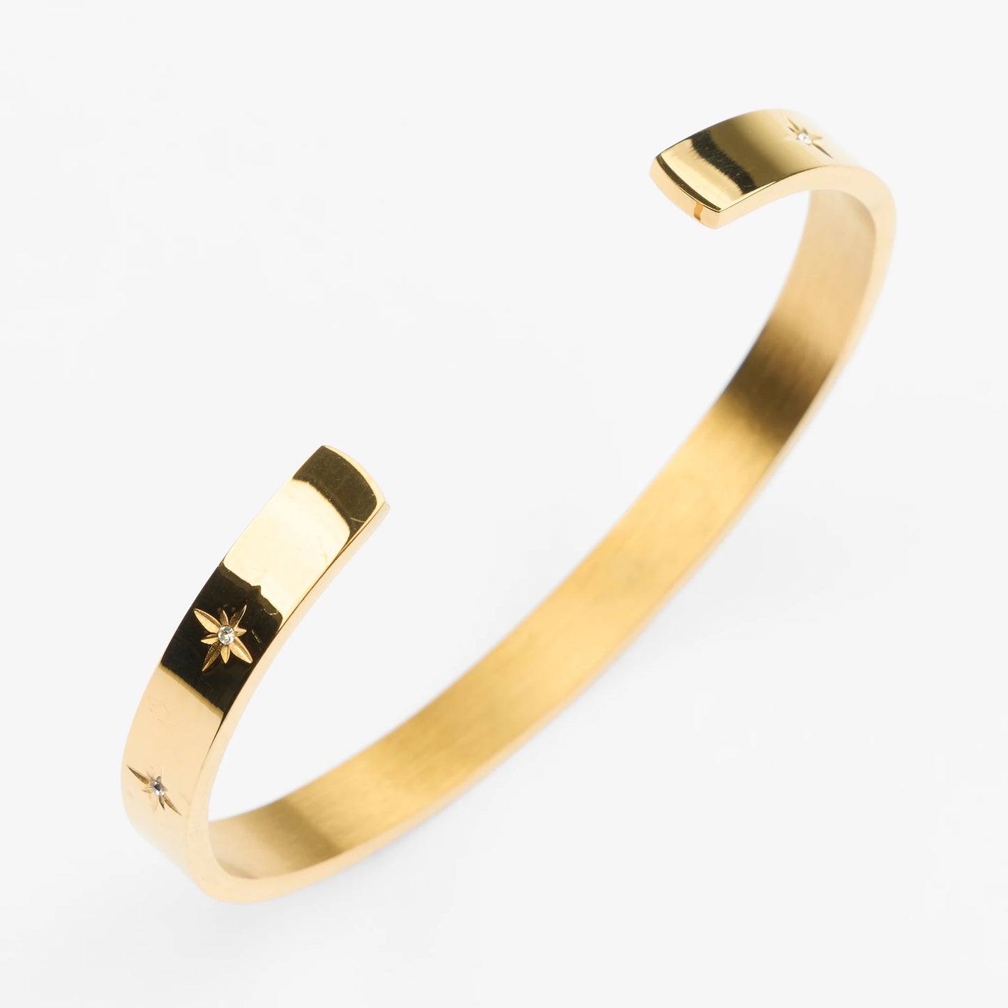 Vandfast guld bangle poleret med sten asteri