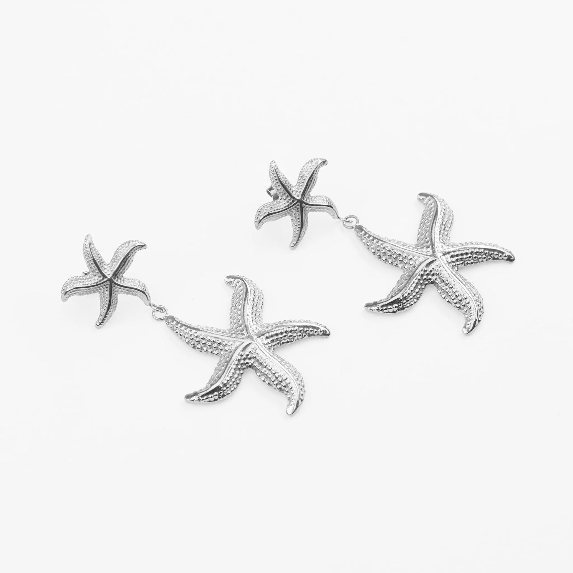 Asterias drop øreringe i sølv med havinspiration