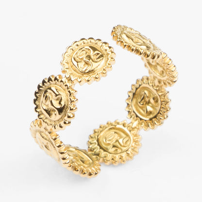 Ilios guld ring med sol ansigts motiver