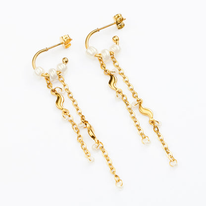 Telos guldøreringe drop på lys baggrund