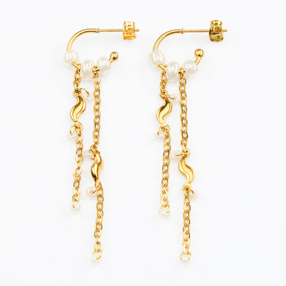 Telos vandfaste guldøreringe på lys baggrund