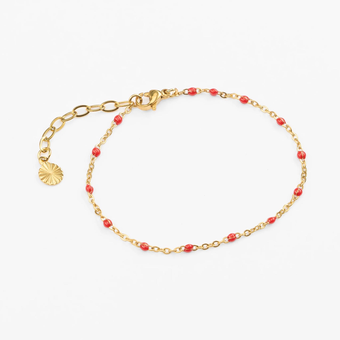 Vandfast guld armbånd med røde perler justerbart