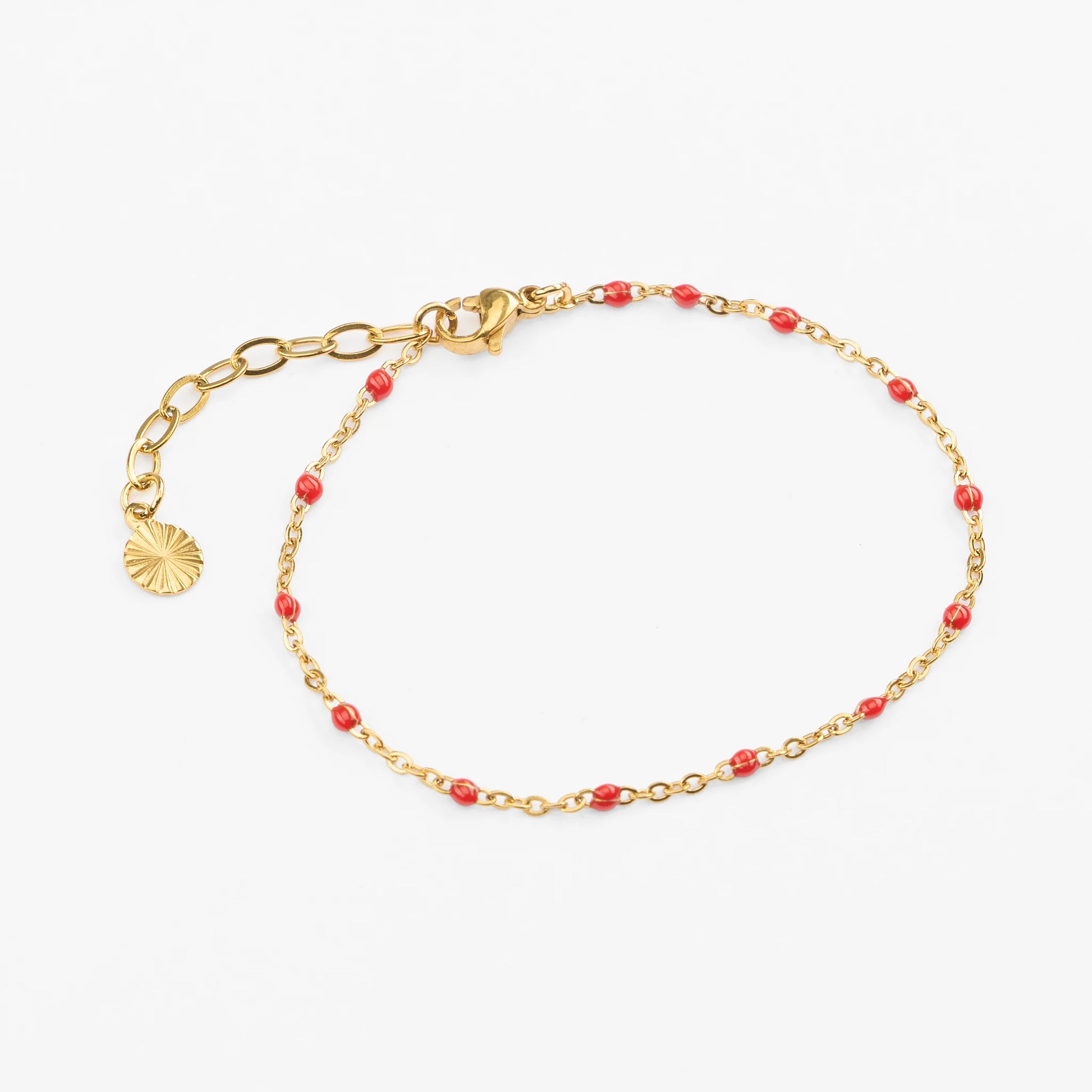 Vandfast guld armbånd med røde perler justerbart